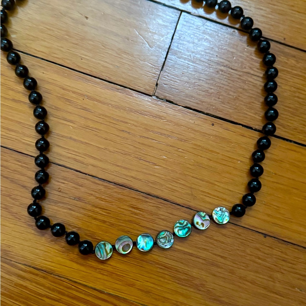 knotted on silk, black onyx and mother of pearl beads, sterling silver clasp